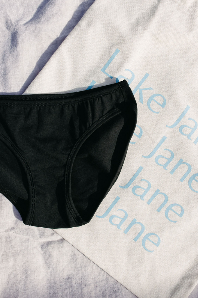 black bikini undies with cotton tote bag